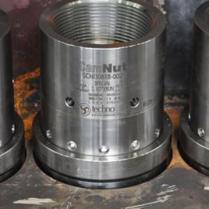 Normally, a bolt tensioning tool pulls on the bolt threads protruding above the regular hex nut, which is then screwed down to retain the loads induced by hydraulic operation of the tool. With no available thread, the CamNut (pictured) performs as the con
