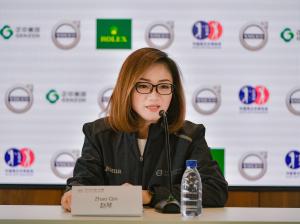 Volvo official Michel Zhao sitting at a table during a press conference