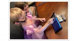 Child wearing polarizing glasses and playing the brightness test on an iPad