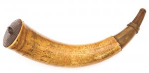 Rev War powder horn from 1775, carved near the base “The Royal Artillery” and owned by Thomas Smith ($44,280).