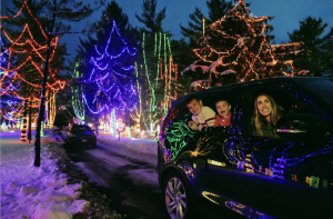 A family drives in their car through the Christmas Carnival of Lights