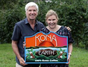 Steve and Joanie Wynn in front of Kona Earth sign