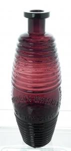 Greeley’s Bourbon Whiskey Bitters bottle with applied top (G102), 9 ½ inches tall, a true purple Greeley’s (estimate: $8,000).