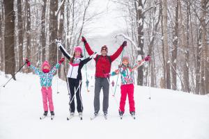 Family Celebrating New Cross-Country Ski Trails