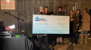 Nancy Kowalik Presents the $32,000 check to Acenda Integrated Health at the yearly VIP Holiday Party.