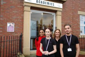 Tina with Sukye Bass a Saks Apprenticeships Educator and apprentices outside Saks Academy Darlington