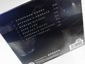 Black back cover of Dark Measures album showing song titles in white.
