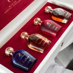 alt="collection of luxury perfumes from niche perfume brands"