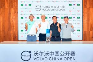 Four Chinese male golfers pose with the glass Volvo China Open trophy