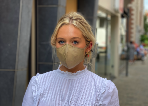 Girl on the street wearing SUPRMASK