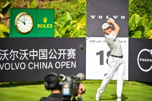 Chinese male golfer Haotong Li playing a tee shot at the Volvo China Open