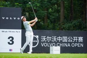 Chinese male golfer Enqi Liang plays a shot from the tee at the Volvo China Open