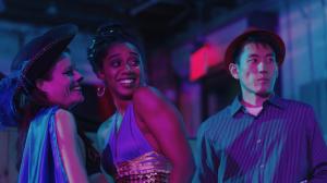 L to R: Stephanie Sellars as “Veronica,” Makeda Declet as “Maya,” and Jake Choi as “Daniel” meet at a polyamorous party in “Lust Life Love,” now available on VOD .