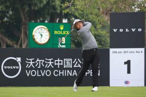 Chinese male golfer Jin Zhang plays a shot from the tee at the Volvo China Open