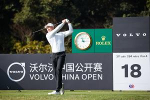 Chinese male golfer Haotong Li hitting a drive from a tee at the Volvo China Open