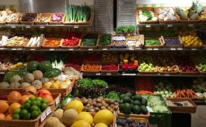 buffered vitamin C. Assortment of fresh fruits and vegetables displayed in baskets at a vegetable store