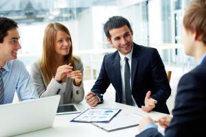 smiling business consultant at table