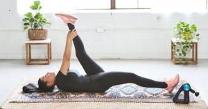 How to get back into ketosis quickly after cheating. Woman dressed in black suit lays on a mat while exercising