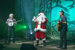 Santa joins the Dublin City Ramblers, Sean McGuinnes and Stephen Leeson on stage at the Sharing is Caring fundraiser at the Scientology Dublin Community Centre.