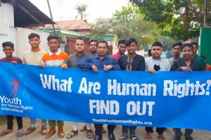 Bangladesh volunteers marched with a Youth for Human Rights banner and distributed human rights booklets.