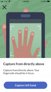 A phone camera captures a photo of a person's hand and fingers inside the Psorcast app. Instructional text about how to capture the image accompanies the photo.