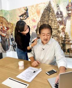 Dalton Tanonaka preparing for TV shoot