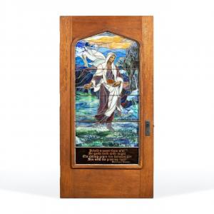 Tiffany Studios leaded and plated Favrile glass panel in oak door from the 1920s titled The Sower, 84 inches tall by 42 ¾ inches wide (estimate: $50,000-$100,000).