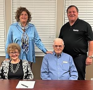 Christenson Transportation and Sharp Acquisition: Rebecca Sharp and John Sharp. Back row: Allie Sharp-Schwalb and Don Christenson