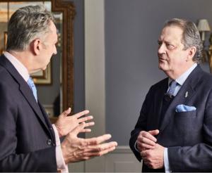 Photograph of David Clarke, outgoing chairman of Fraud Advisory Panel standing on the left in conversation with Sir David Green CB QC the incoming chair of the Panel