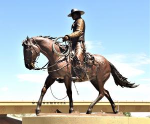 Cowboy buckaroo riding horse