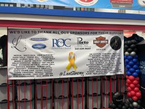 Banner for charity event with ROC logo on it