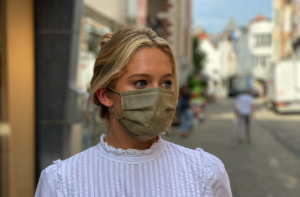 Girl wearing SUPRMASK in the street