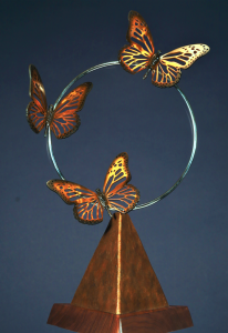 Butterflies flying through a circle