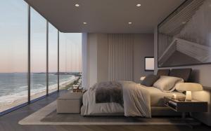 An artist impression of the master bedroom with beach views at LUXE Broadbeach.