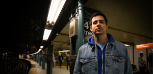 Matthew "Boy Pierce" standing by a New York City subway.