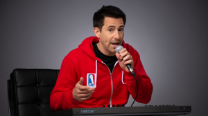 Rapper and producer Boy Pierce sitting by a piano recording songs.