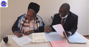 Empress Queen Sheba III and Governor Boleilanga signing agreement