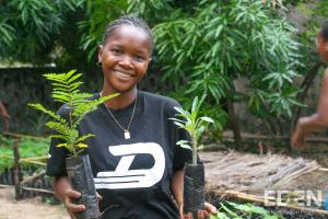 Mamatiana Holding Seedlings Eden Reforestation Projects