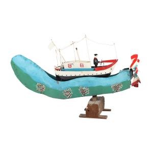 Important whirligig in tin of a white ship on blue seas by Quebec artist Ernest Joly, circa 1970, rocks back and forth when the propeller turns (estimate: CA$2,500-$3,000).