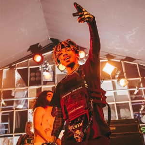 A Photo of Kamiyada+ Performing on Stage. He is featured on Rap Artist Dauble's Latest Song Release "Don't Beat Yourself Up".