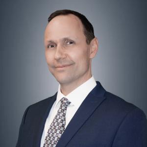 Jason Nessler, Kent Imaging's Vice President of Product Development, pictured in a portrait style in a dark suit.