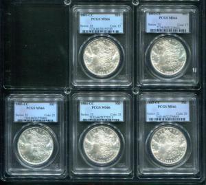 Lot of five Morgan silver dollars, all from the Carson City, Nevada Mint and dated 1881-1885, each one graded highly at MS66, gaveled for $8,475.