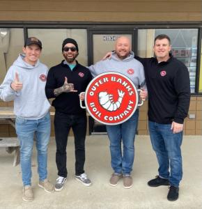 The Outer Banks Boil Company of Hatteras Island owners in front of New location in Avon, NC.