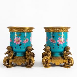Gorgeous pair of 19th century porcelain bronze mounted urns attributed to Sevres (French) and Victor Paillard (French, 1805-1886), 16 inches tall (estimate: $4,000-$6,000).