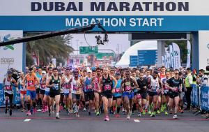 A large group of runners set off at the start of the Dubai Marathon