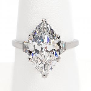 Vintage platinum and diamond engagement ring given to Mrs. Woodruff by Robert, with a 4.61-carat marquise brilliant cut center diamond (estimate: $80,000-$120,000).