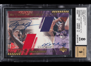 A rare 2000-01 Upper Deck Game Jersey Combo Michael Jordan and Kobe Bryant dual autograph basketball card is currently on offer in the PWCC February Premier Auction. This historic card is the very first dual jersey, autographed set ever made.