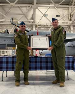 Commanding Officer Lieutenant Colonel Renato Duarte (l) with Honourary Colonel Michael Ravenhill (r) presented with the official order at the Investiture Ceremony.