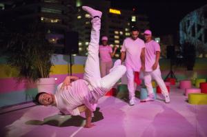 People break dance during a party at Museum of Ice Cream Austin