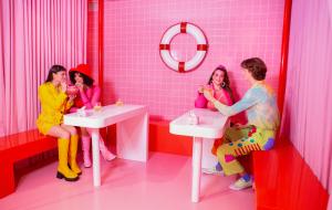 Friends enjoy ice cream cocktails in the cafe at Museum of Ice Cream Austin